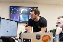 Hosting specialists watching their monitor.